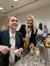 Two dentists share mimosas at a network event